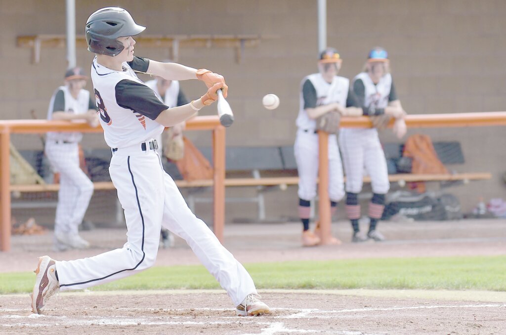 Rhett Clark puts the ball in play during game one of the Thursday, May 25 doubleheader against the Chadron Nationals. The Tigers lost game one 19-5 but won game one 2-0. Andrew Towne/Torrington Telegram
