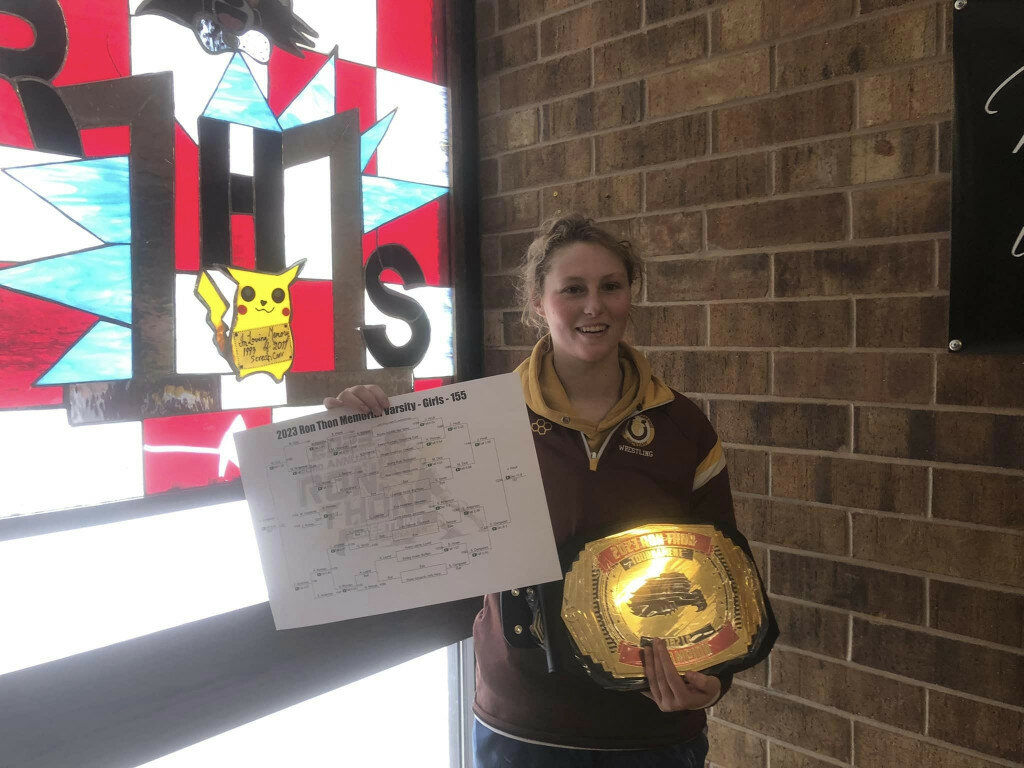 Courtesy photo/Chris McNees
Josie Houk poses for a photo with the Ron Thon Invite bracket and championship belt on Saturday.