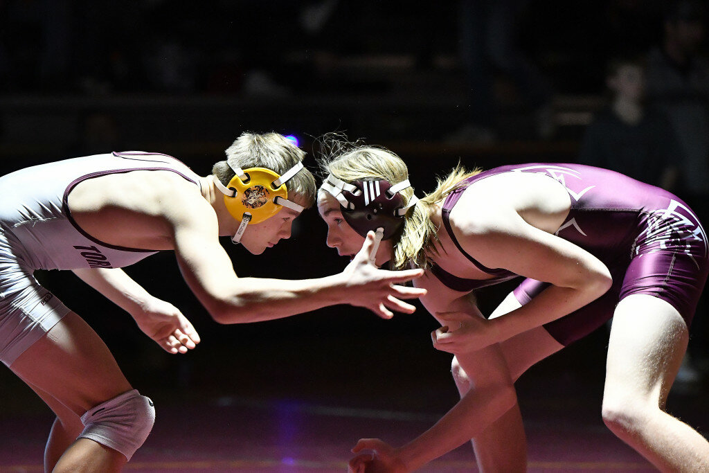 Andrew Towne/Torrington Telegram 
Colby Sandusky (left) and Griffin Wolfe (right) do battle for Torrington High School at the Maroon and Silver Duals on Tuesday at Willi Gym. Sandusky picked up an 11-2 major decision victory.