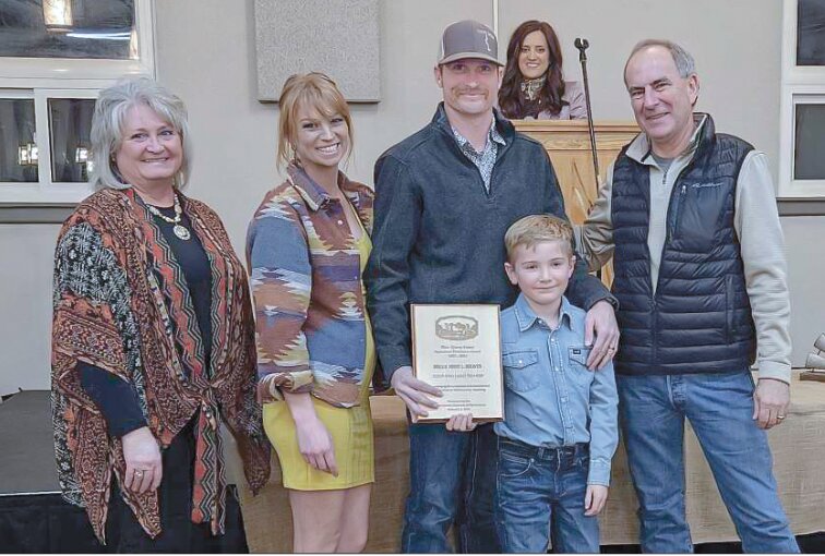 Business of the year... Karen Thayer (l-r), and Leah and Colt Thayer, owners of Mill Iron L Meats accept the Ag Business of the Year award from Kit West during the 2024 Ag Appreciation Banquet. For more about the banquet.