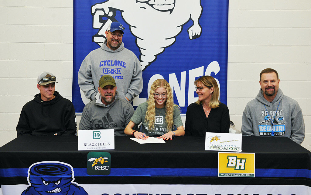 Southeast senior Tylar Stoddard, center, signed to compete on the BHSU indoor and outdoor track teams on January 4. Pictured, from left, are Bridger Stoddard, Tony Stoddard, Southeast track coach Jeff Logsdon (in back), Tylar Stoddard, Cathy Stoddard and Southeast head track coach Jeff Fullmer.