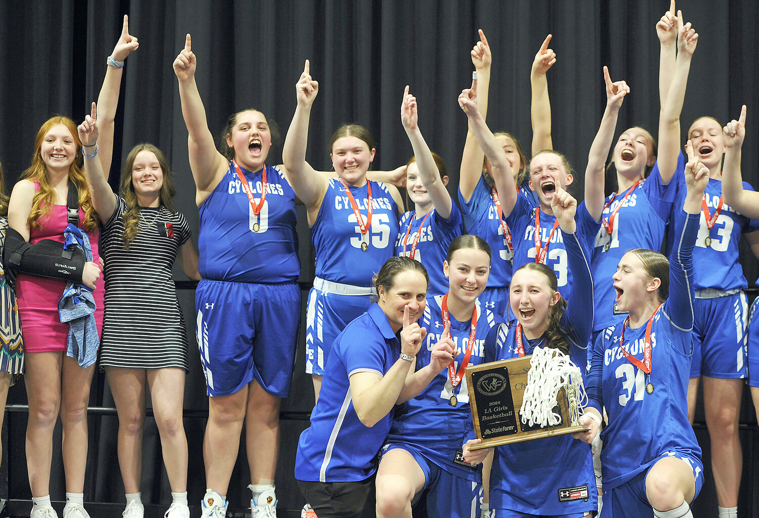 Your 2024 1A Wyoming State Basketball Champions – the Southeast High School Lady Cyclones! Pictured, in front, from left, are Coach Jennifer Scheer, Kylee Llewellyn, Baylie Booth and Sasha Haines. In back, from left, are Brylie Booth, Taylor Tregemba, Haylee Ekwall, Brea Mills, Macy Tremain, Anna Hartman, Kaycee Kosmicki, Hadley Leithead, Brooklyn Leithead and Rein Carlson. More on B1