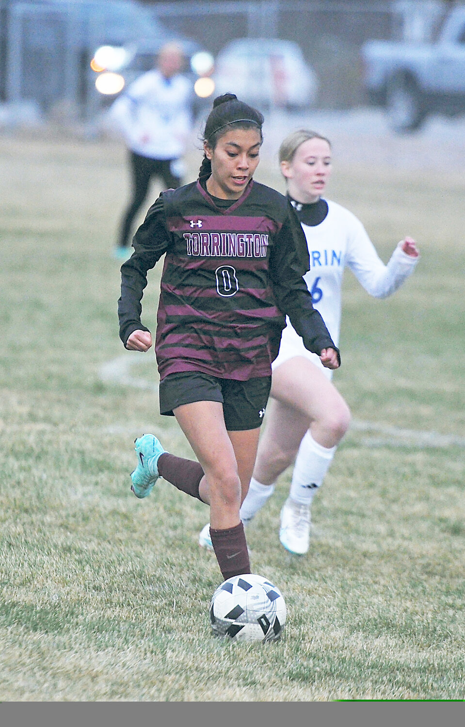 Junior Marisol Munoz maneuvers the ball into Gering’s territory in the first half of the March 26 game at Torrington’s Wiseman Field.