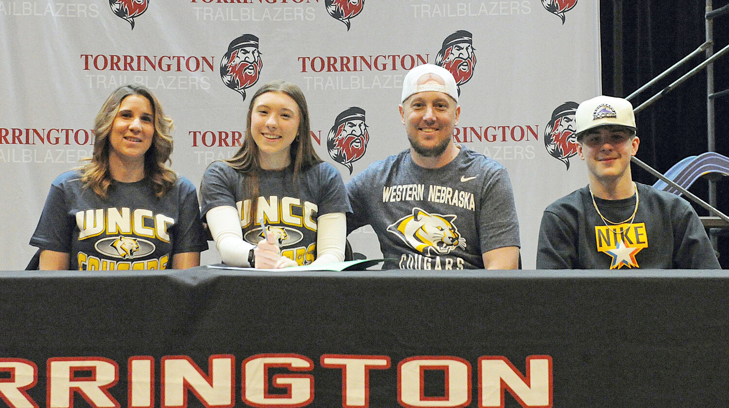 Torrington High School senior Alyssa Albaugh, second from left, signed to play softball with the Western Nebraska Community College Lady Panthers at a ceremony with family and friends on March 21. Pictured, from left, are Ashley Albaugh, Alyssa Albaugh, David Albaugh and Ty Albaugh.