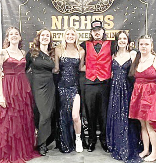 Getting together for a photo op at prom are  Berkleigh Pafford (l-r), Sponsor Laura Green, Julianna Schiele, Dawson Bingham, Brooke Offe and Shelbie Bowen.
