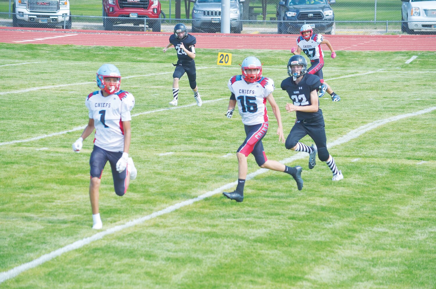 Nathan Van Natter (22), above, and Lukas Rotz (73), right, put their all on the field in Viking Stadium during one of the first games of the season.