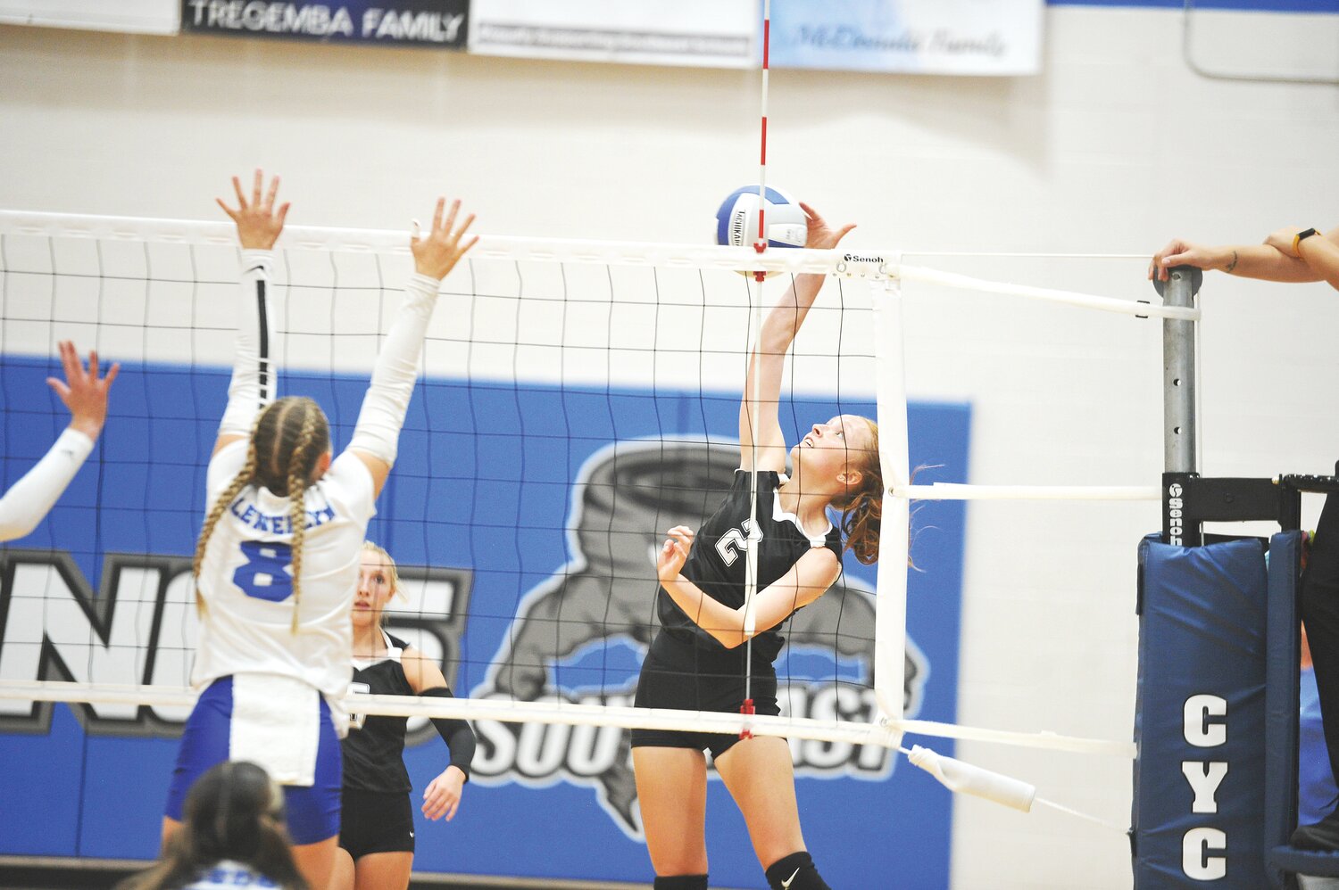 Jordan Atwood (2), reaches to hit the ball over the net.