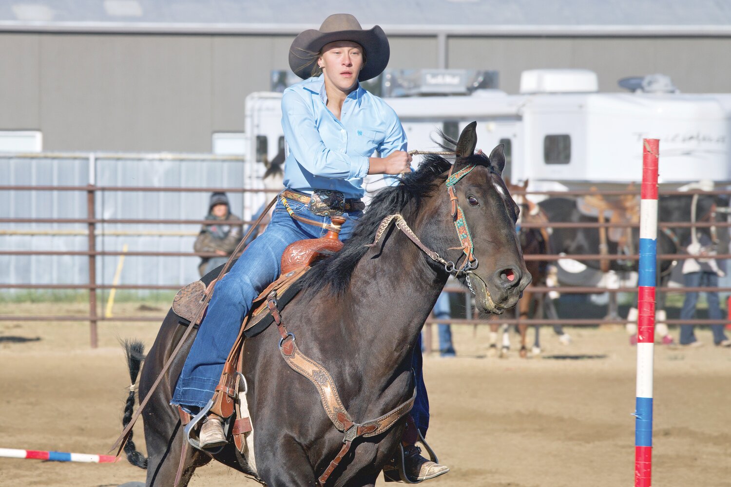 Madison McIntosh races through the poles during the Wheatland Rodeo in September.