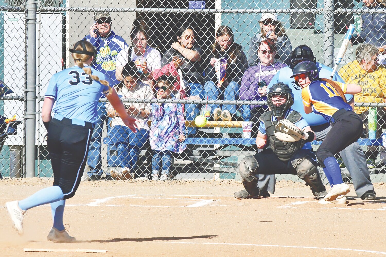 Camryn Mickelsen eyes the ball as she prepares to smack it out of the park in a game earlier in the month. Mickelsen has hit several home runs and some doubles this season.