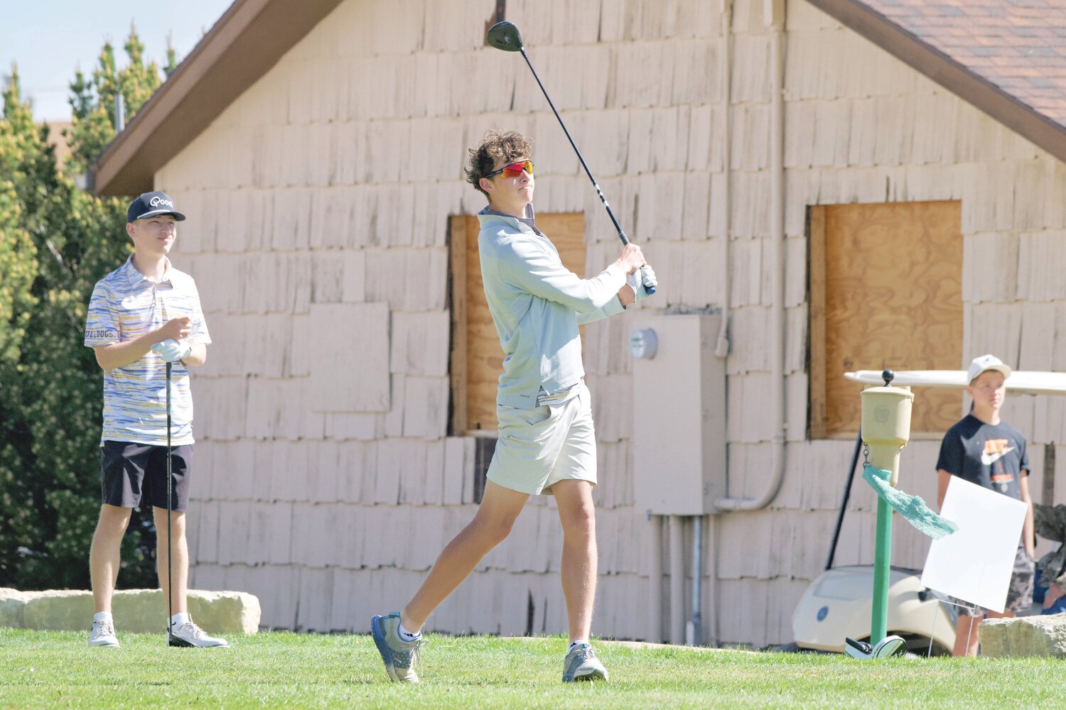 Tate Nichols (right) holds his follow through after teeing off at the Wheatland Golf Club during a tornament while teammate Brecken Sandlian seems satisfied with his yardage. Last week, Tate Nichols won the USwing Mojing Junior World Championships Qualifier in Laramie at Jacoby Golf Course. The win punches his ticket to the Junior World Tournament held at Torrey Pines in San Diego, California on July 5th-10th.