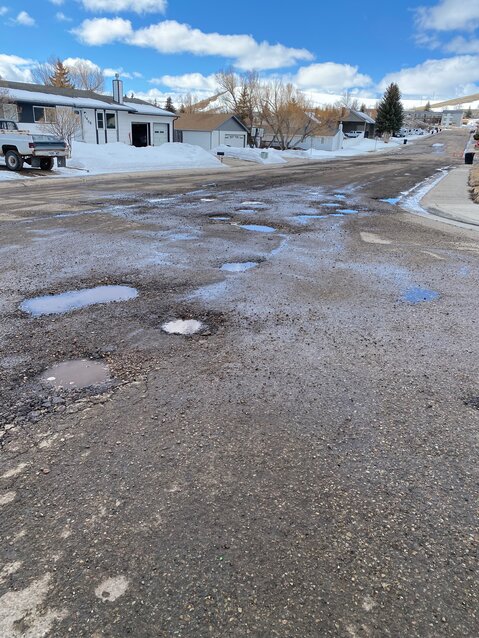 Kemmerer’s Elk Street and Sixth West Ave. are riddled with potholes as warming temperatures have melted the often icy surface on city streets.
