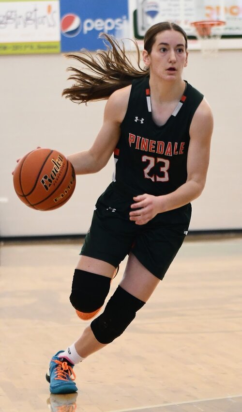 Junior Elyn Bowers enters Mountain View territory during the state basketball championship in Casper. Bowers’ performance over the season, including breaking three records, earned her 3A All-State honors, 3A West All-Conference accolades and the title of 3A West Player of the Year.