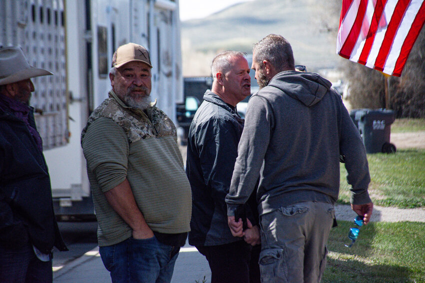 A verbal altercation breaks out between Sublette County resident Brandin Glenn, right, and Hogs for Hope supporter Tony Smith, who came to Daniel from Iowa for what was billed as a peaceful protest. Onlookers to the left include locals Mitch Gilliam and Lonny Johnson.