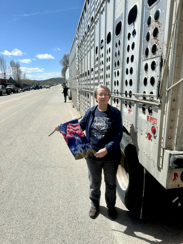 Kelly Ravner, a Sublette County resident, sports her Hogs for Hope rally t-shirt and waves a flag of support during the ride through Daniel on Sunday, May 26. Many Sublette County residents at Sunday's event were unwilling to be interviewed or provide their names, but Ravner remains an outspoken advocate for predator management reform in Wyoming.