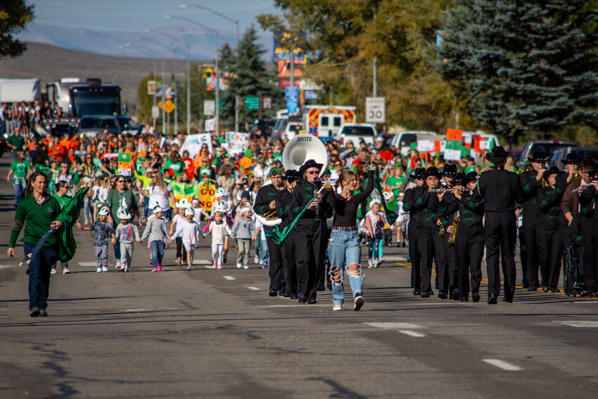 Students from Pinedale High School all the way down to Pinedale Preschool turn Pine Street into a sea of green and orange as they participate in the 2024 Wrangler Homecoming Parade on Friday, Sept. 20. Leading the group in front is Taylor Wickham.