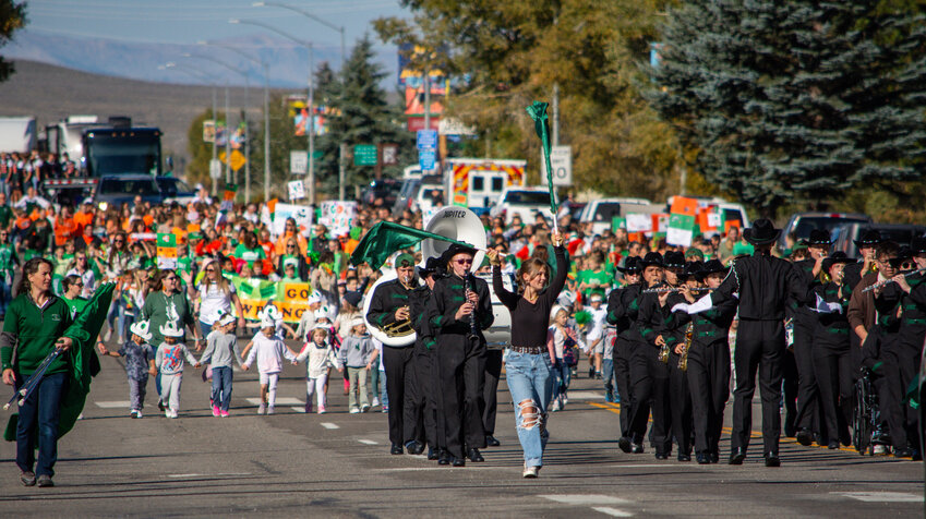 Students from Pinedale High School all the way down to Pinedale Preschool turn Pine Street into a sea of green and orange as they participate in the 2024 Wrangler Homecoming Parade on Friday, Sept. 20. Leading the group in front is Taylor Wickham.