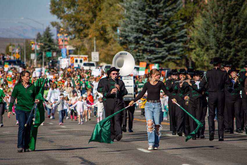 Students from Pinedale High School all the way down to Pinedale Preschool turn Pine Street into a sea of green and orange as they participate in the 2024 Wrangler Homecoming Parade on Friday, Sept. 20. Leading the group in front is Taylor Wickham.