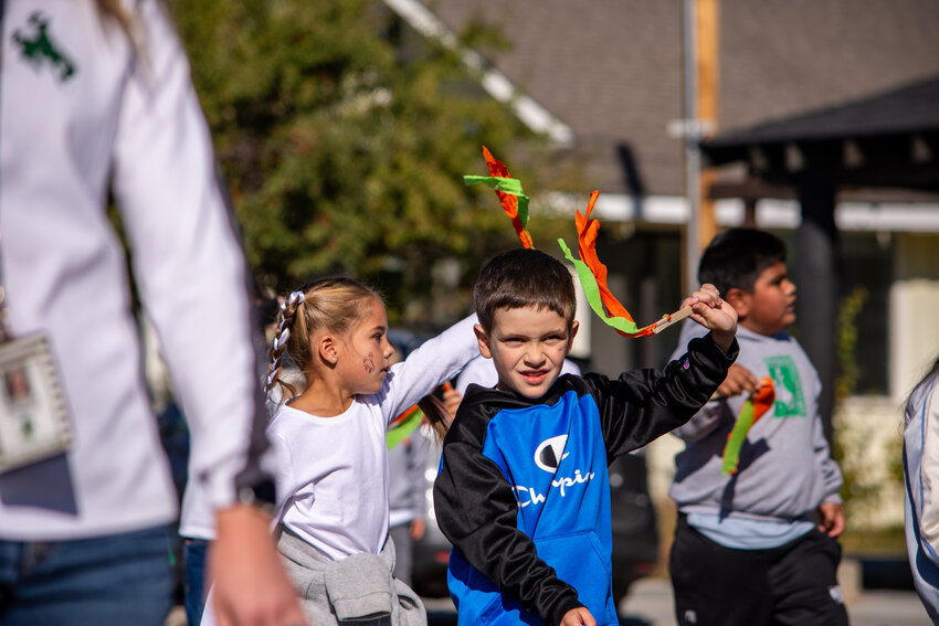 Students of all ages show their support for the Wranglers during the Homecoming Parade. 
