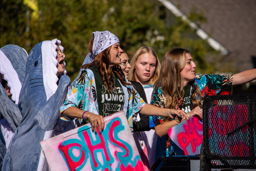 McKinzie Mortensen and Bryanna Wackerman interact with the crowd gathered to watch the Homecoming Parade. 
