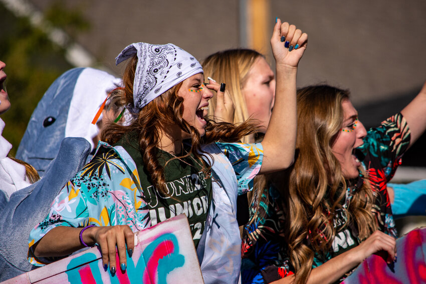 McKinzie Mortensen and Bryanna Wackerman interact with the crowd gathered to watch the Homecoming Parade. 
