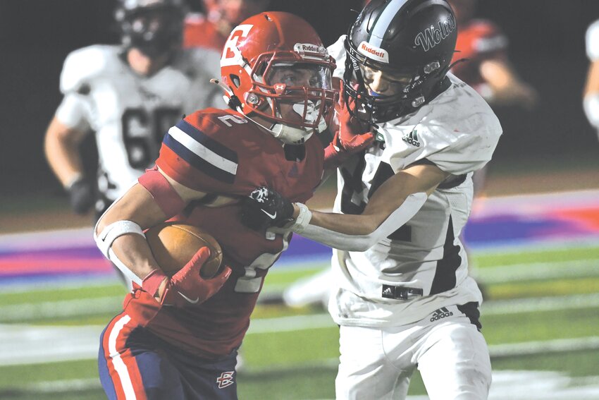 Red Devils running back Brayden Wallace stiffarms a Green River defender en route to 171-yard night during Friday’s 32-7 Homecoming win at Kay Fackrell Stadium. Evanston is now 1-0 in 4A West conference play, and is on the road at Cody Friday.