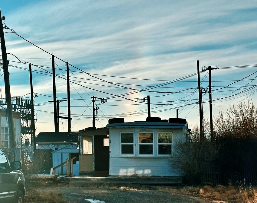 A sundog appears over Dakota Farley’s trailer — where he lived and died — on the evening of Feb. 11. His father Ray has been cleaning out his murdered son's home while planning for his funeral.