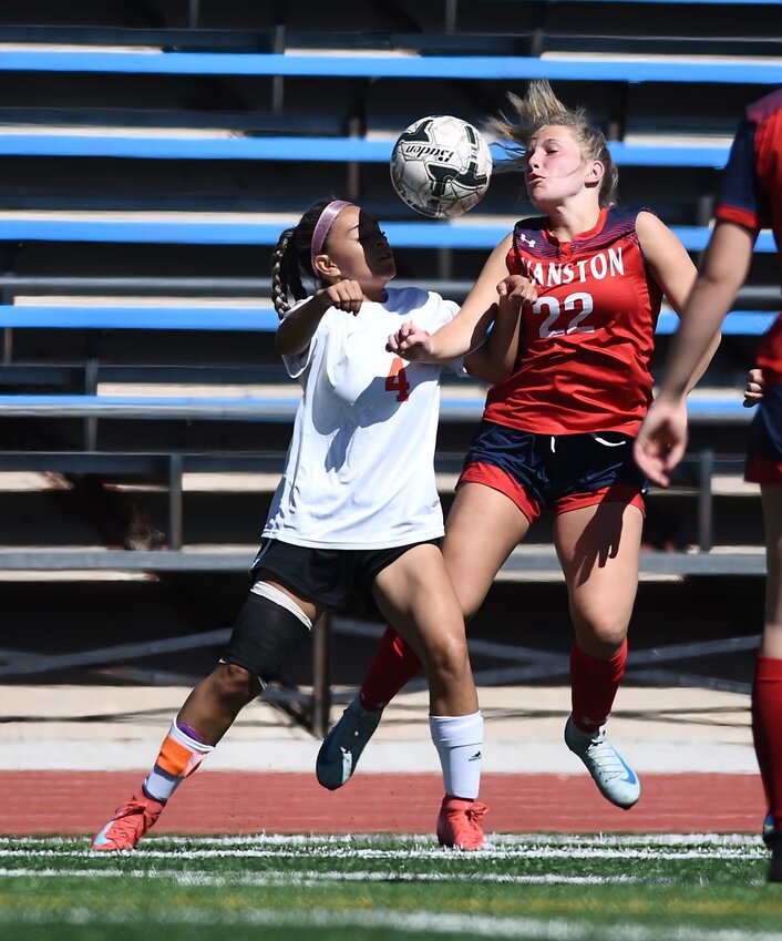 Lady Devil Kyrsten Hiatt wins a ball out of the air during Saturday’s 11-0 loss to Jackson at Kay Fackrell Stadium. The Lady Devils beat Star Valley 1-0 earlier in the week to complete the season sweep of the Lady Braves.