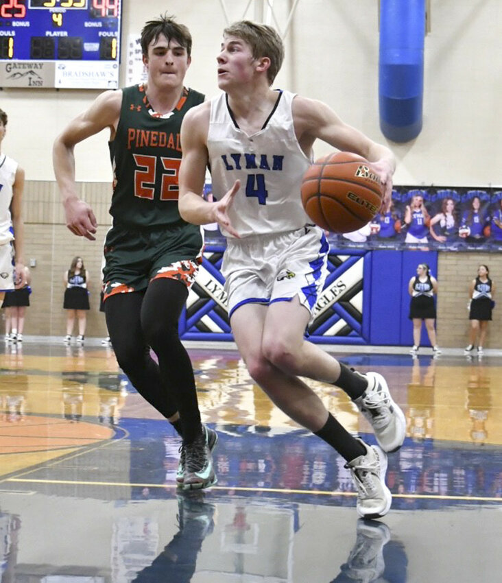LHS Eagle Carter Bradshaw, senior, drives in for a basket in the team’s game against the Pinedale Wranglers last week on Thursday in the Eagle Lair. COURTESY PHOTO/Chary Porter