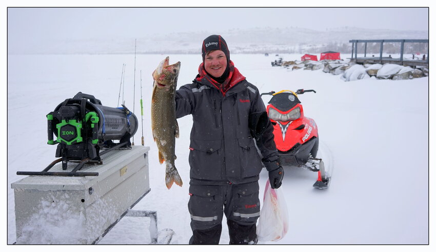 Connor Bailey, of Pinedale, shows off his 6.2 pounds, 27” lake trout which won him Sunday’s $1,000 grand prize.