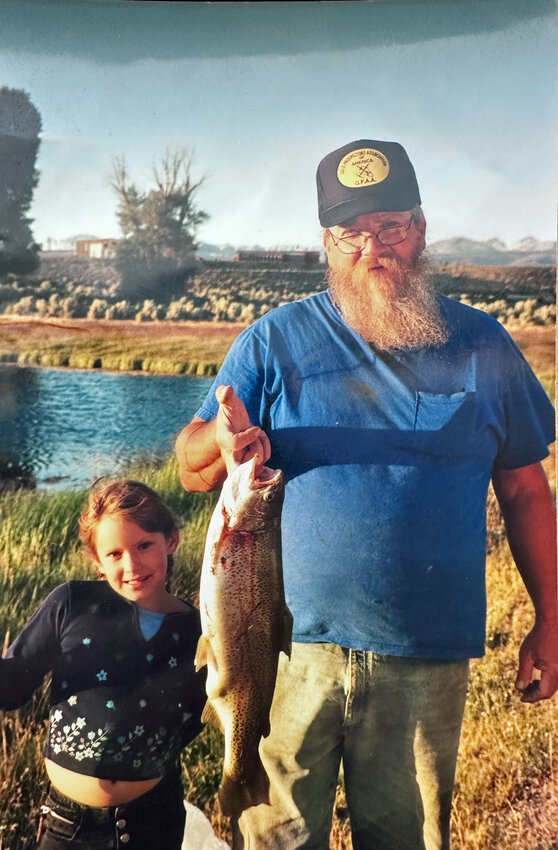 Kaisha Simpson, then age 7, stands with her maternal grandfather and abuser Robert Wayne McCutchan in this undated fishing trip photo she provided to the Pinedale Roundup. On Feb. 27, McCutchan was sentenced to prison for sexually assaulting Simpson beginning from the time she was 6 years old.