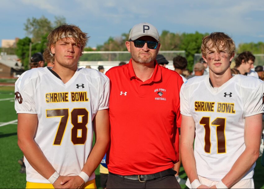 Big Piney High School football players Zack Murphy, No. 78, and Reuben Stoutneburg, No. 11, stare fiercely into the camera alongside BPHS Head Football Coach Jeromy Moffat at the 51st Annual Wyoming Shrine Bowl on Saturday, June 8.