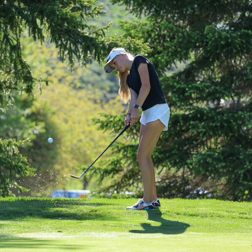 Kemmerer golfer Tazlyn Wagner chips a shot on to the green during the Utah State Junior Amateur earlier this month. Wagner won the girls’ 13-14 division.