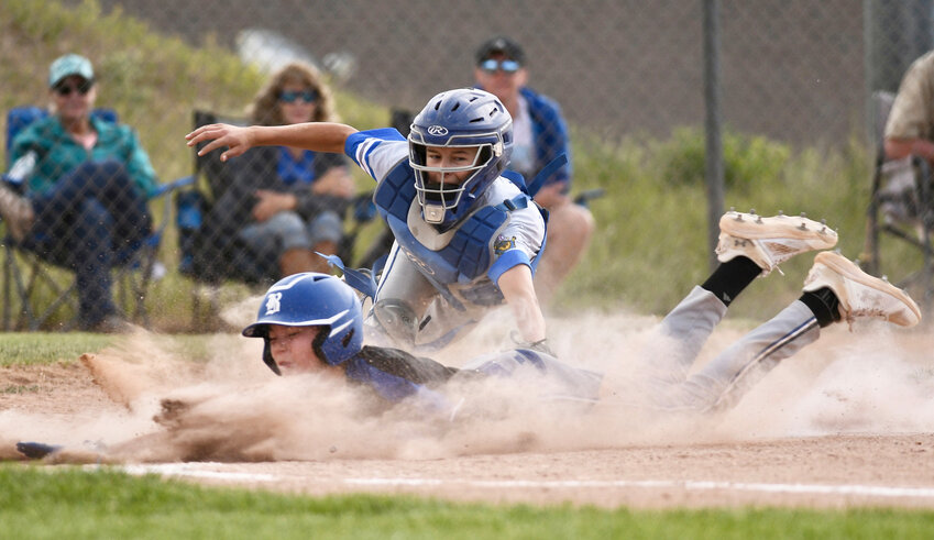 Post 41 Regulators catcher Lane Debenham makes a play at the plate on a Bear Lake baserunner Friday at Ross Kesterson Field. It was a busy weekend of baseball for the local Little League and Post 41 teams, with the annual Summer Slam Tournament keeping ball fields busy and fans entertained.