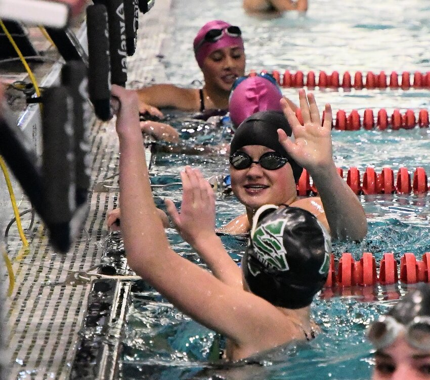 Lady Ranger Ally Bartschi celebrates her finish in the 50 freestyle with Green River’s Zoie Gilmore at Saturday’s Evanston Invitational. Bartschi finished sixth in the event, while the Lady Rangers finished fourth overall as a team.