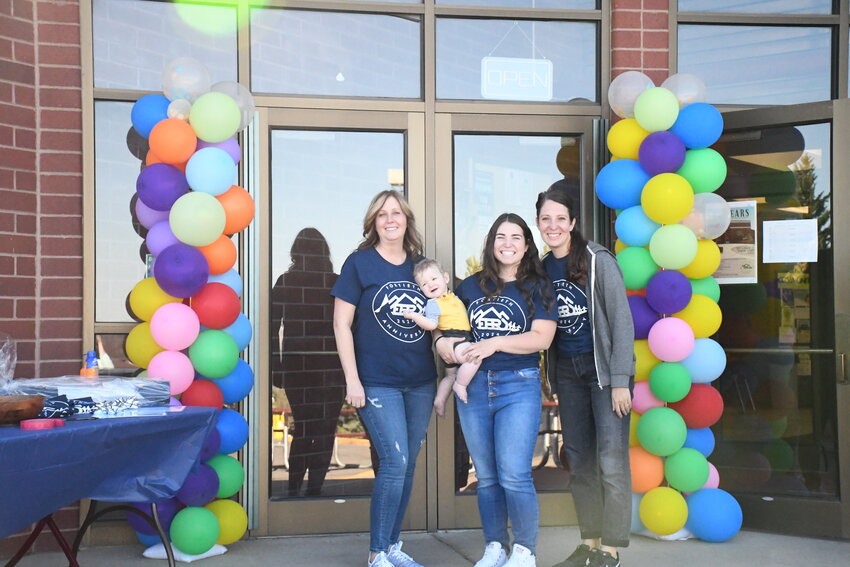 Business Manager Lisa Jacketta, Jay Devereaux, Savanna Calchera and Recreation Division Manager Alicia Melchior welcome guests to a free day at the Evanston Rec Center on Saturday, Sept. 22, to celebrate 40 years of operation.