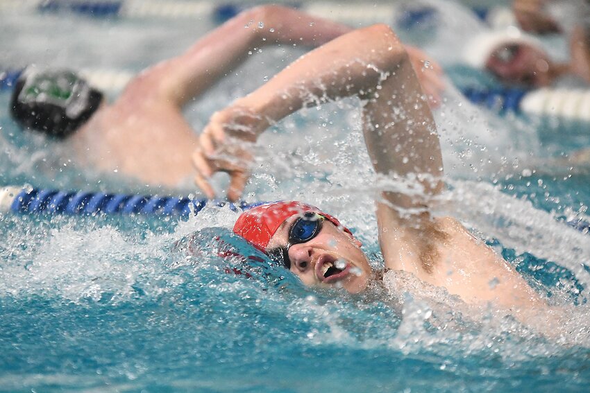 Red Devil swimmer Jacob Olson — seen here swimming the 200 freestyle at Saturday’s 4A West Conference Championship — had a weekend to remember at the Davis Middle School pool. Olson won the 500 freestyle in a conference record-breaking time of 5:13.16, earning All-Conference honors; he also finished third in the 200 freestyle, with a time of 1:52.96. The Red Devils finished third overall as a team.