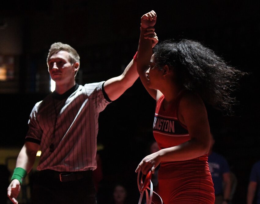 Lady Devil Sydney Liechty is declared the winner of the 110-pound 3rd-place match at Saturday’s 4A West Regional Tourney in Evanston. Liechty won a 7-3 decision over Powell’s Allison LeBlanc to claim bronze.