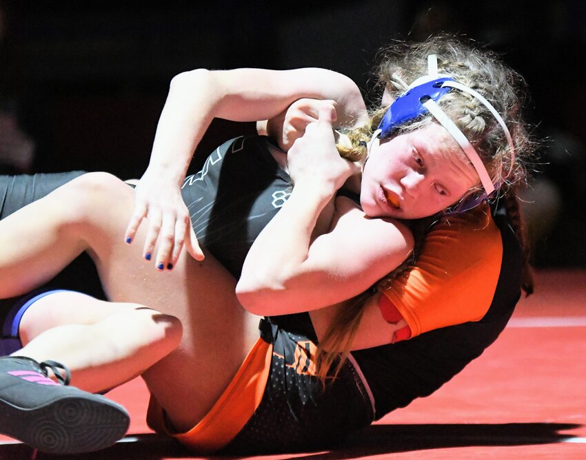 Lady Eagle Gracelynn Allen works to gain an advantage against Jackson’s Tai McBride in the 125-pound championship match at Saturday’s 4A West Regional Tournament in Evanston. Allen came up short in the match, but finished runner-up at 125 pounds.