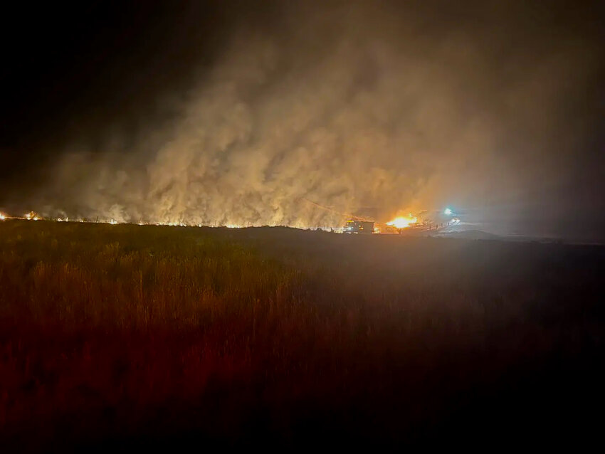 Smoke rises from a wildfire burning in Campbell County.