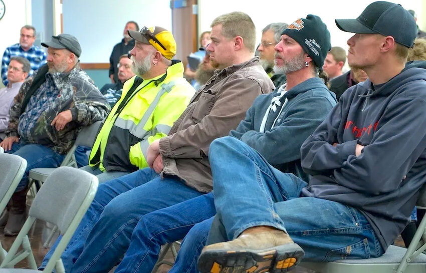 Kemmerer area residents listen to public comment during a January 2020 Wyoming Public Service Commission meeting. Some in the crowd wore safety clothing suggesting employment at the mine, power plant or railroad.