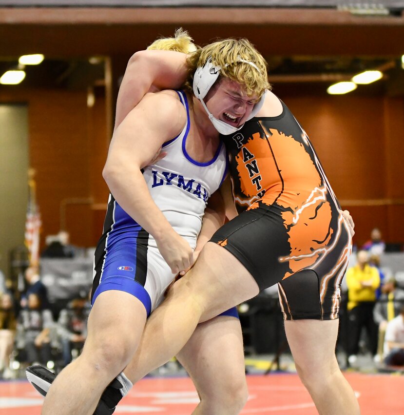 LHS freshman Treysen Henderson attempts a switch against Lander’s Ty McWilliams during Saturday’s 106-pound championship match at the 3A State Wrestling Championships in Casper. Henderson lost the match in OT to finish runner-up.