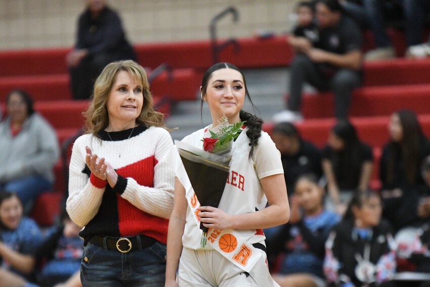 Lady Ranger Natasha Martinez stands with mom Tamey Peternal during Senior Night last month. Martinez has signed to play basketball at Rocky Mountain College next season.
