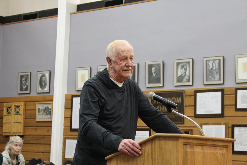 John Davis, Evanston Historic Preservation Commission volunteer worker on the steam engine 4420, confronts Mayor Williams and city attorney Mark Harris with his concerns over the memorandum of understanding, and that it doesn’t protect the engine from being removed from the Roundhouse, along with the city’s treatment of the volunteers working to restore the engine.