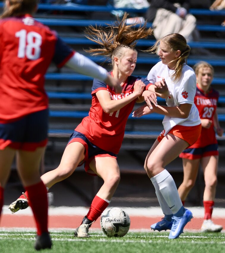 Lady Devil Julia Barton battles for possession of the ball during Evanston’s 2-1 loss to Rock Springs Friday at Kay Fackrell Stadium. Barton scored the Lady Devils’ lone goal.