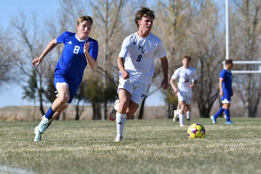 Mountain View’s Brendon Walker brings the ball up the pitch as Lyman’s Cal France gives chase during the Buffalos’ 3-1 win Friday at Eagles Stadium. The win gave Mountain View the season sweep over their Bridger Valley rivals.