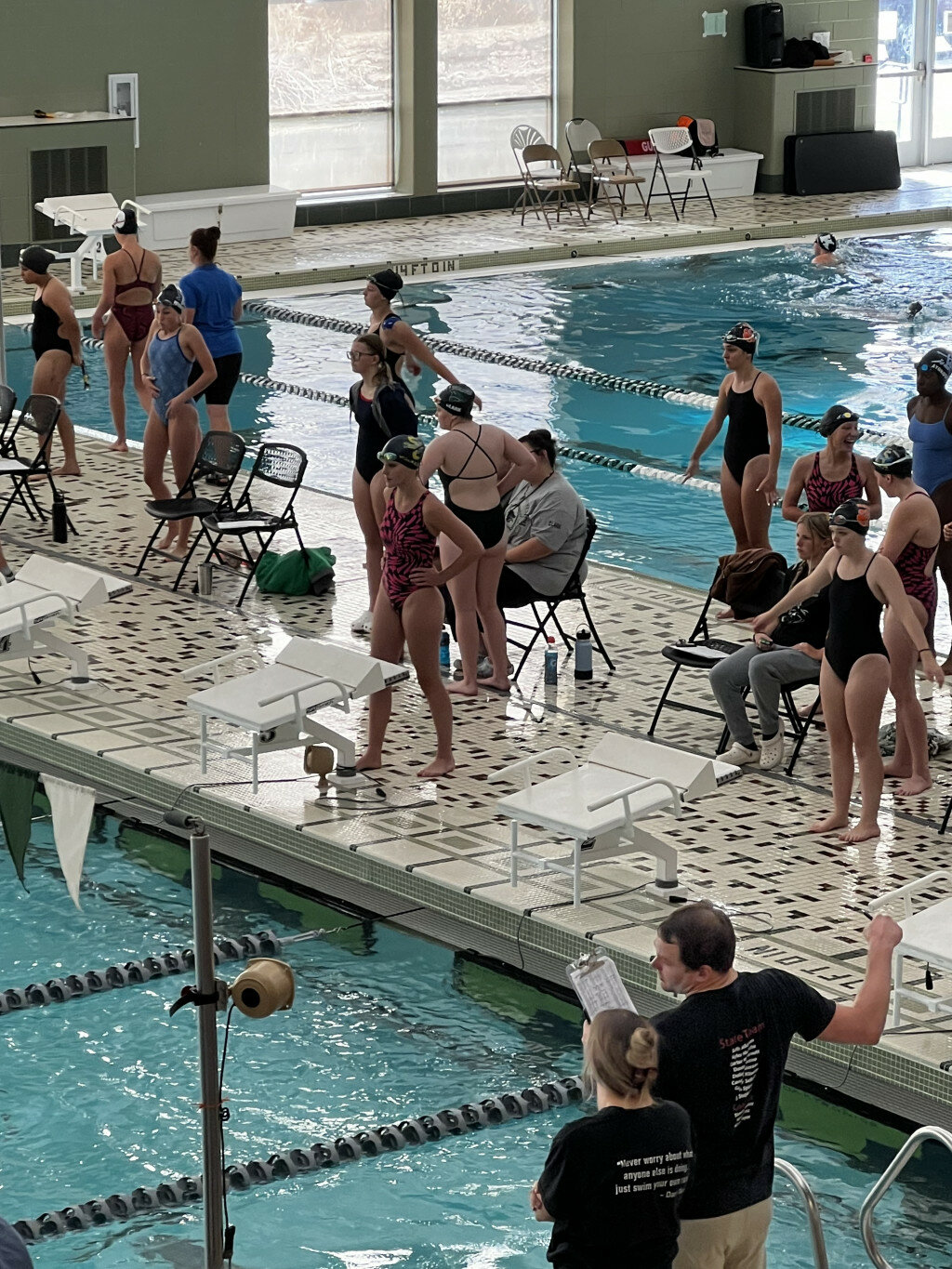 Courtesy photo
PHS junior Maggie Walker, center in pink and black, approaches the starting blocks before an event at the Green River Fall Invite on Sept. 2.