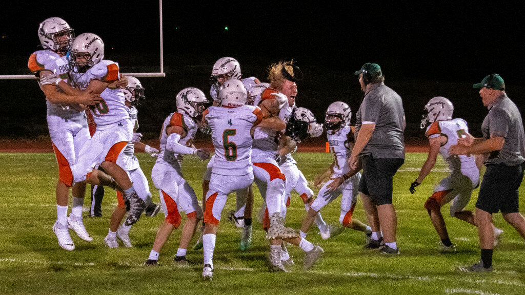 Sandy Wanfalt photo
Overjoyed Wranglers celebrate Pinedale’s first victory in two years against non-conference rival Rawlins on Sept. 1.