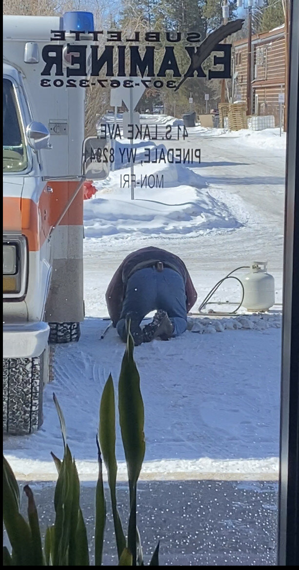 Cali O'Hare file photo
Plumbers work to repair the frozen pipes at the office of the Pinedale roundup and Sublette Examiner. Town officials are encouraging residents to leave their bleeders running through mid-April to prevent freezing lines.