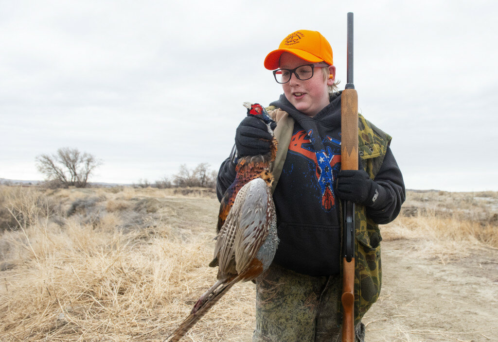 Mark Davis, Powell Tribune photo
Brice Peters checks out the first rooster pheasant he ever harvested while on a Saturday mentored hunt program sponsored by the First Hunt Foundation. The hunt was the pilot bird hunt for what is now called the "Outdoor University," a mentoring program using volunteers to teach people a variety of outdoor skills.