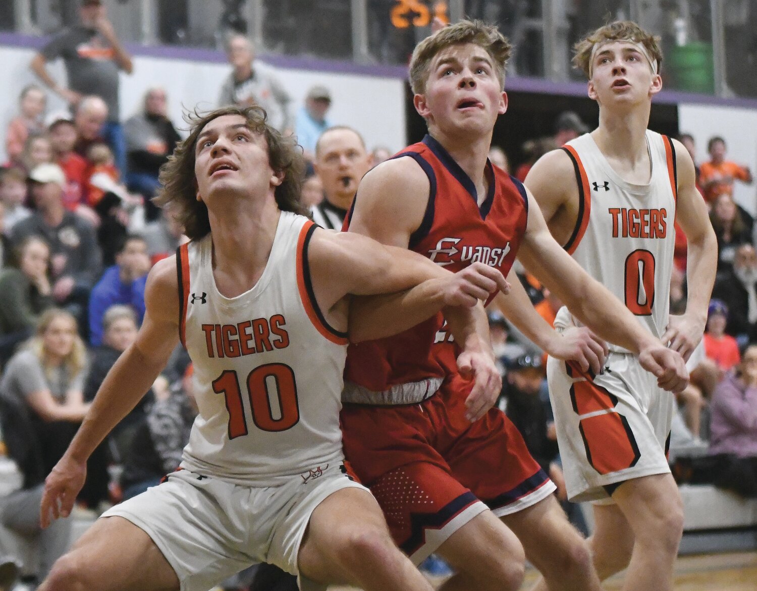 Red Devils senior Luke Robinette boxes out for a rebound during Evanston’s 49-41 win Saturday over Rock Springs at the 4A West Regional Tournament in Green River. The Red Devils qualified for the State Tournament on the strength of that win.